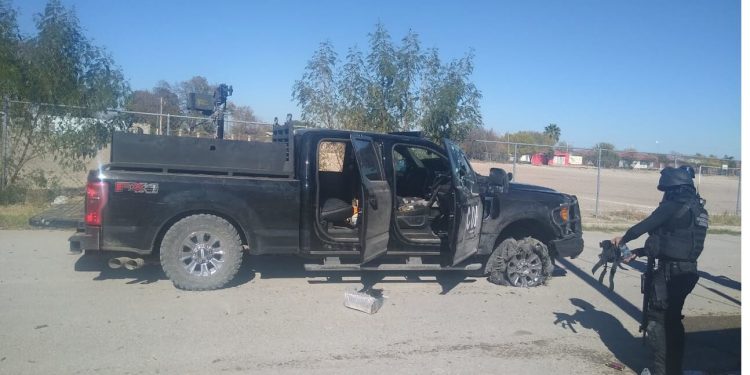 At least 20 dead in gun battles near Texas border